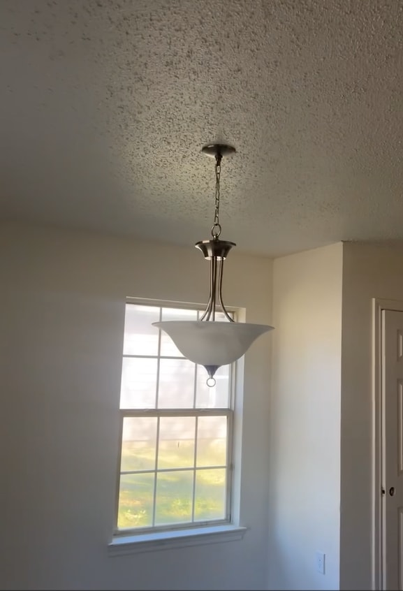 Spacious dining area with modern light fixture. - 4720 Burma Rd
