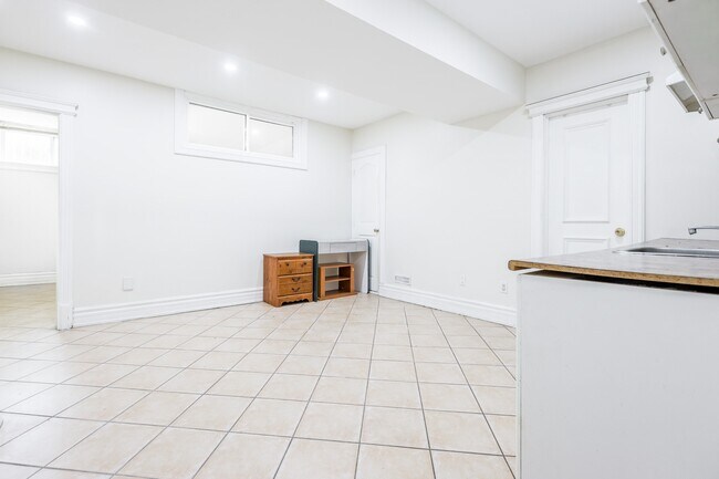 Building Photo - Bright, Beatutiful & Look Out Basement Apt.