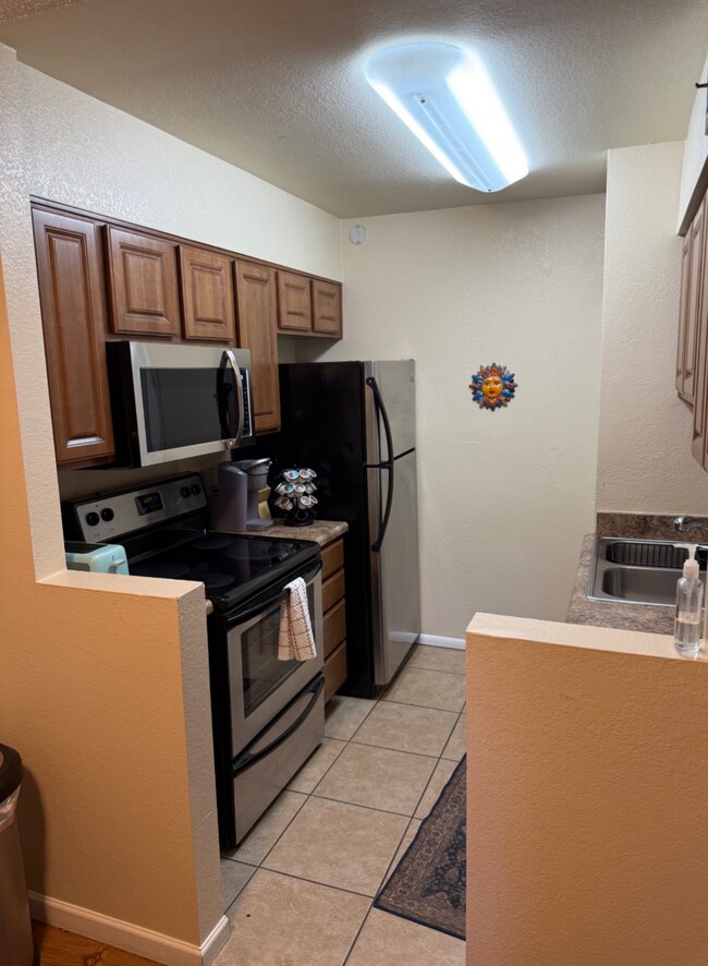 Kitchen with new large microwave. - 1745 E Glenn St