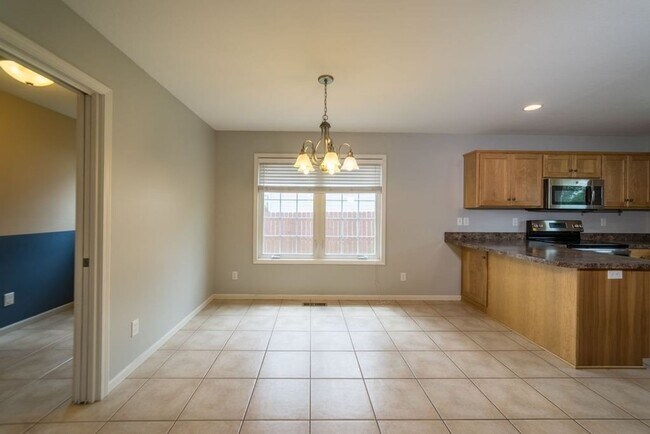 Building Photo - CLOSE TO FORT RILEY! FENCED BACKYARD!
