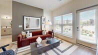 This well-appointed 2-bedroom, 2-bathroom residence at 550 S Dawson St in Aurora, Colorado offers a thoughtfully designed single-floor layout with modern finishes throughout. The open-concept kitchen is a standout feature, showcasing light wood cabinetry, stainless steel appliances including a full-size refrigerator and range, a white quartz waterfall island with seating, and striking matte black pendant lighting — all complemented by light wood-style flooring that flows seamlessly through the space. The living room is bright and inviting, featuring large windows that invite abundant natural light and outdoor views of the surrounding neighborhood. Both bedrooms are well-sized, offering large windows with exterior views, recessed lighting, and dedicated closet space. The primary bathroom presents a long, elongated layout with a light wood vanity, white quartz countertops, matte black hardware, and a soaking tub with shower. The second bathroom mirrors the same contemporary aesthetic with a wood-framed vanity, quartz countertop, and built-in shelving. Two closets provide ample storage throughout the residence. The clean, neutral palette and consistent use of warm wood tones and matte black accents create a cohesive, modern ambiance across all rooms.