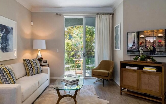 Living Room with Access to Private Balcony and Natural Light - Amerige Pointe