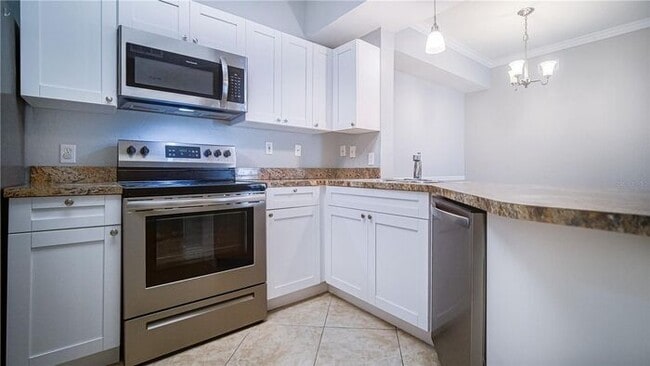 Building Photo - Free application fees 2 Bedroom condo with 2 Baths and balcony minutes from The Mall at Millenia