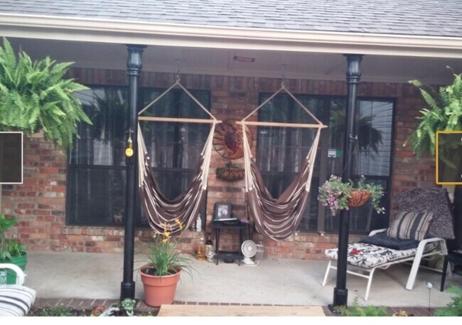 Front patio with koi pond. - 303 Laurel Hill Dr