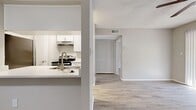 This one-bedroom, one-bathroom unit in Tampa, Florida offers a thoughtfully arranged single-level layout with a neutral, light-toned interior throughout. Light wood-style laminate flooring runs continuously across all rooms, complementing the warm gray walls and white trim to create a clean, cohesive aesthetic.

The open living and dining area greets residents upon entry, featuring a ceiling fan and direct access to the kitchen via a pass-through bar with a light stone-finish countertop. The galley-style kitchen is efficiently designed with white shaker cabinetry, matching light countertops, stainless steel appliances including a refrigerator, dishwasher, and range, and an under-mount sink — maximizing every inch of the corridor layout.

The bedroom is a comfortable size, featuring a ceiling fan, a window with natural light, vertical blinds, and a textured ceiling. A walk-in closet with wire shelving provides practical storage. A hallway connects the bedroom to the full bathroom, which includes a tub-shower combination, a white vanity with a stone-finish countertop, and matching wood-style flooring. The dining area offers additional flexible space suitable for a home office or secondary living use.