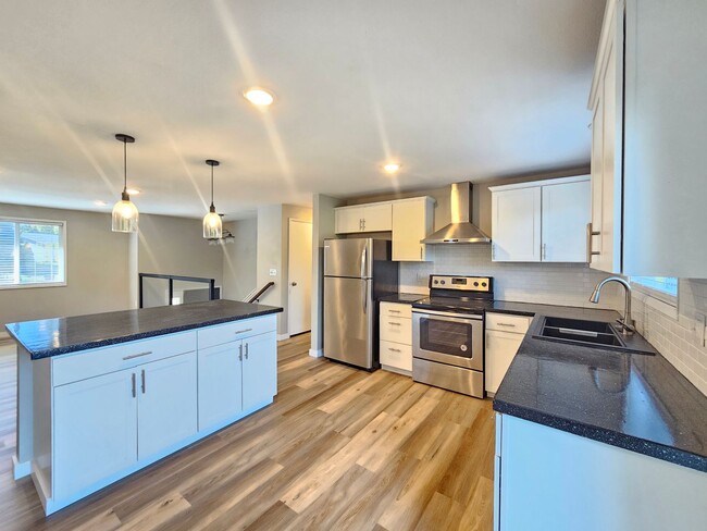 Building Photo - 1721 E 58th Ave