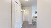 Located at 4085 Warner Ave in Hyattsville, MD, this one-bedroom, one-bathroom residence offers a thoughtfully organized single-floor layout. The kitchen features warm wood-tone cabinetry, granite-style countertops, light hardwood-style flooring, and black appliances including a gas range, dishwasher, and refrigerator — providing a functional and efficient cooking space. Adjacent to the kitchen, the dining area is carpeted and brightened by a window, accented with a ceiling fan and wall décor, offering a comfortable setting for meals. The living room is a welcoming retreat with plush carpet, neutral walls, and a sliding glass door that opens to a private balcony, allowing natural light to flow in and providing pleasant outdoor views. The generously sized bedroom includes soft carpeting, a window for natural light, and an open closet for convenient storage. The full bathroom is finished with tile flooring, a tub/shower combination, and a wood-toned vanity, maintaining a clean and practical aesthetic. A connecting hallway ties the rooms together seamlessly. Throughout the residence, a consistent warm, neutral color palette creates a cohesive and inviting ambiance well-suited for everyday living.