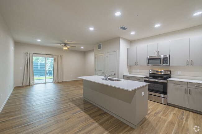 Lido, cocina y sala de estar - Legacy Oaks Apartments