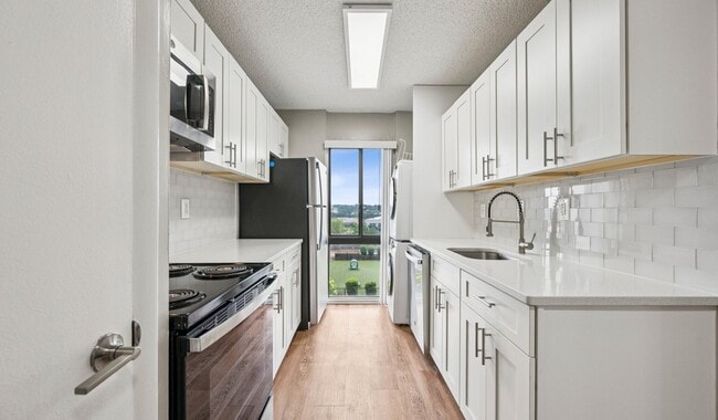 Your modern kitchen has large counter space and updated appliances - The Summit