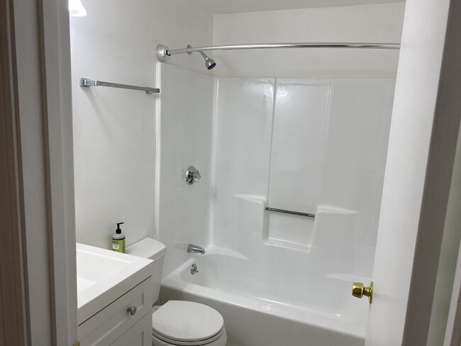 newly renovated tub/shower - 150 School St