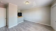 Located at 802 Park St in Troy, Alabama, this single-floor, one-bedroom, one-bathroom unit offers a compact and efficiently organized layout. Throughout the space, light gray luxury vinyl plank flooring provides a cohesive, easy-to-maintain surface, complemented by neutral gray walls, white baseboards, and textured ceilings.

The living room serves as the entry point, featuring a wall-mounted PTAC heating and cooling unit, a window with blinds allowing natural light, and a flush-mount ceiling fixture. The space flows directly into the kitchen, which is defined by a peninsula with a butcher block countertop — ideal for dining or meal prep. The kitchen is equipped with gray cabinetry, matching butcher block counters along the back wall, a black refrigerator, black electric range, and a single-basin sink.

The bedroom is a comfortable size, featuring a ceiling fan with light fixture, a window overlooking the outdoors, and direct access to both the bathroom and a closet. The bathroom includes a full tub/shower combo with a curtain rod, a toilet, and additional storage. Clean finishes and a straightforward layout make this unit a practical, move-in ready space.