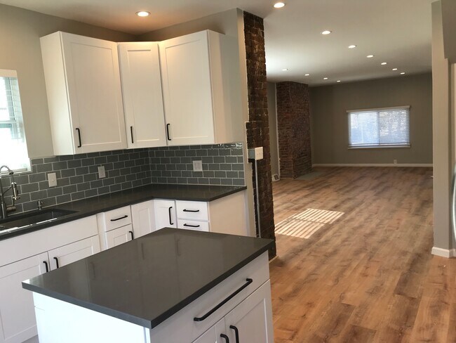 looking from kitchen at front - 717 Boggs Ave