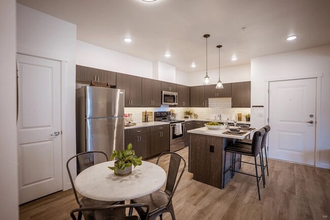 Building Photo - Brand New! AC & 1 covered parking spot inc...