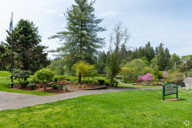 A paved path leads neighbors the beautifully landscaped Stella Olson Memorial Park n the Sherwood/Tualatin North Neighborhood.