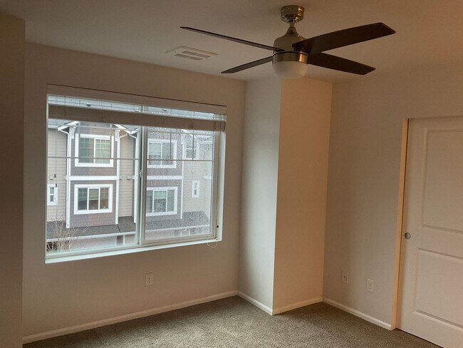 Building Photo - Riverfront Townhome with Tandem Garage & Fenced Yard