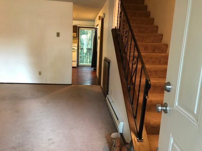 Living room, and stairs up - 7033 20th Ave SE