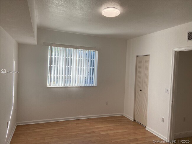 Building Photo - 3241 Sabal Palm Manor