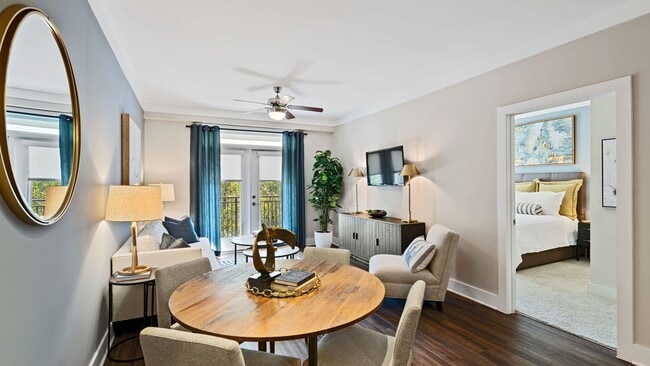 Open, spacious floor plans with luxury vinyl plank flooring in entry, kitchen and living room - Marshall Park Apartments + Townhomes
