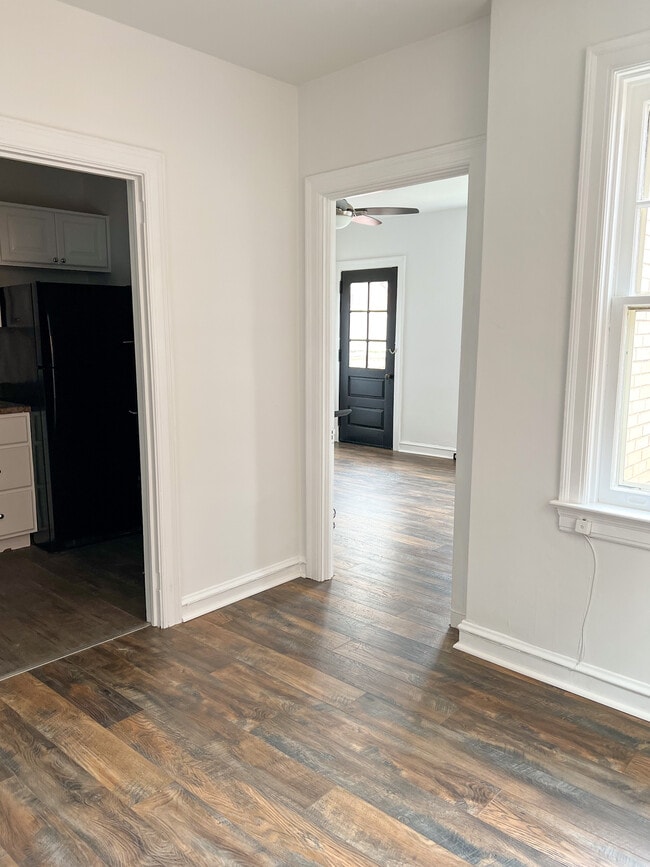 View from entry, looking into kitchen (left) and bedroom - 325 N Duke St