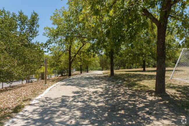 Barton Hills Park has shaded walking and running paths boarding the park's soccer field.