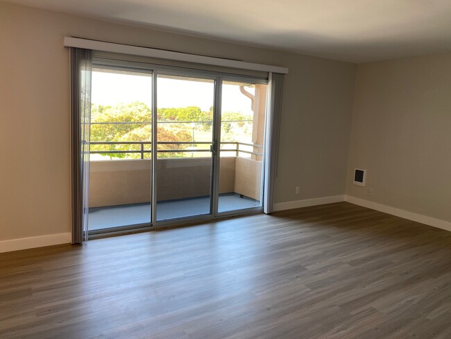 2BR, 2BA - Living Room/Balcony - Casa de Flores Apartments