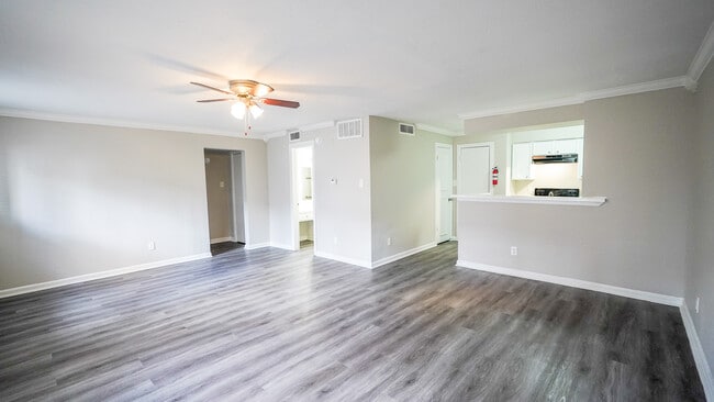 Spacious Living Room with Ceiling Fan - Windsor Manor