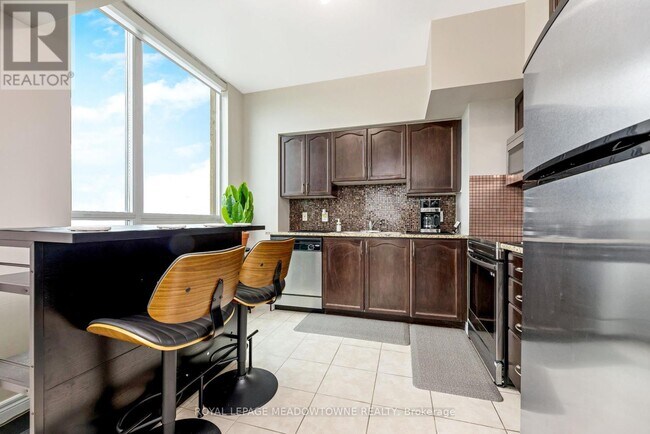Building Photo - 208-3208 Enfield Pl