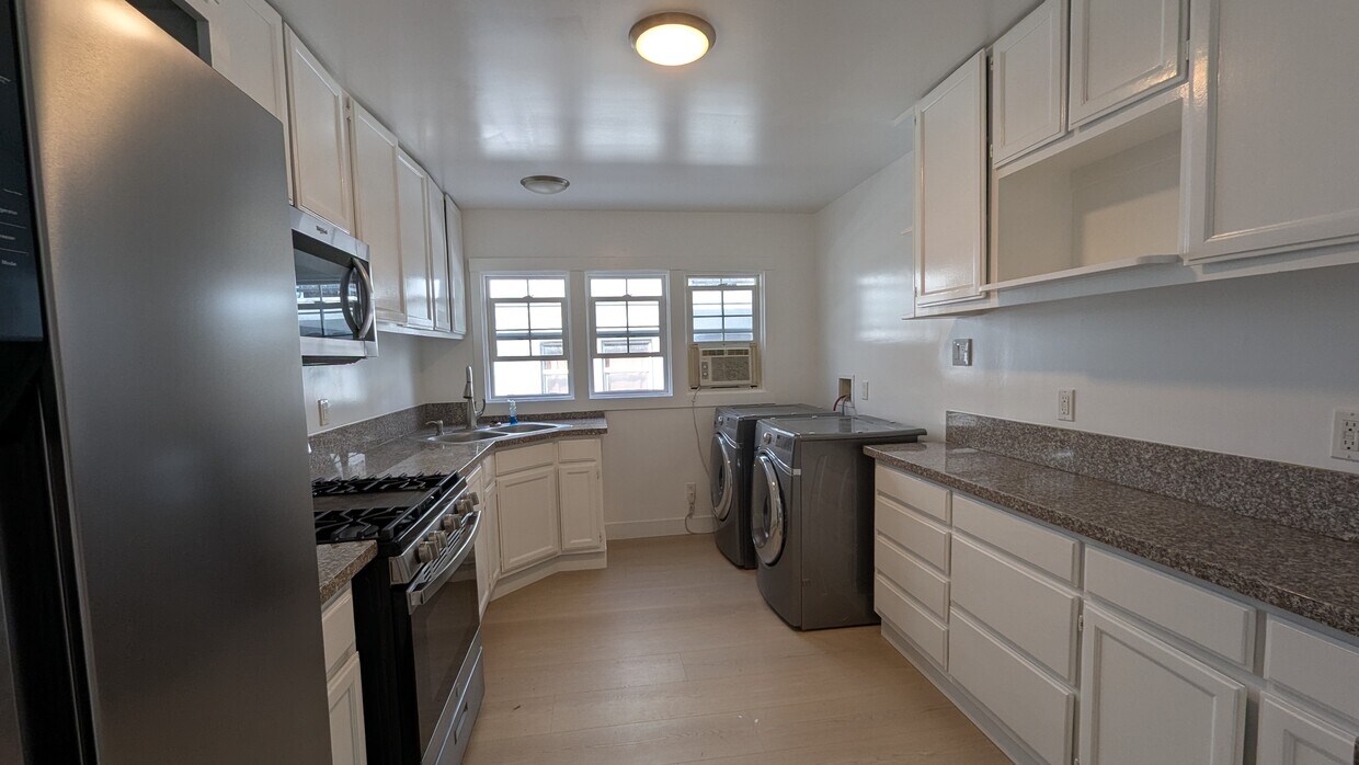 Kitchen with new refrigerator and washer/dryer - 1261 S Plymouth Blvd