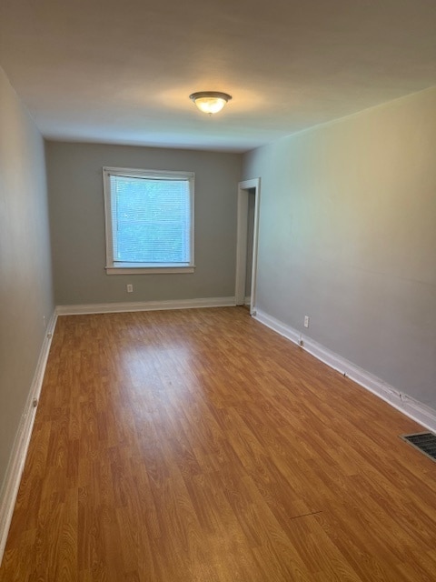 Building Photo - Adorable 2BR/1BA with spacious living area and wood floors throughout!