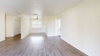 Located in Clearwater, FL, this 2-bedroom, 3-bathroom single-floor residence offers a well-organized layout designed for comfortable everyday living. The living and dining areas are finished with durable hardwood-style flooring and feature a textured ceiling, a ceiling fan, and sliding glass doors that open to a private balcony, allowing natural light to fill the space and providing pleasant outdoor views. The kitchen is equipped with white cabinetry, dark countertops, a double stainless steel sink, and a dishwasher, with a window above the sink that brings in additional daylight. A connected hallway leads seamlessly through the unit. Both bedrooms are carpeted and bathed in natural light through sizable windows with vertical blinds. The generously sized primary bedroom offers ample space and dedicated closet storage. Across the unit, six closets provide exceptional storage capacity. The three bathrooms are finished in crisp white tile, each featuring a tub-shower combination. Clean, neutral wall tones throughout create a bright and versatile ambiance, making this residence a practical and inviting home in the heart of Clearwater.