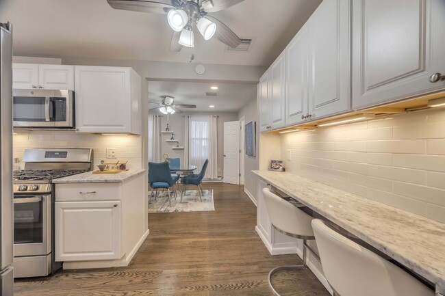 kitchen,, granite counter and view of dining room - 306 Church St