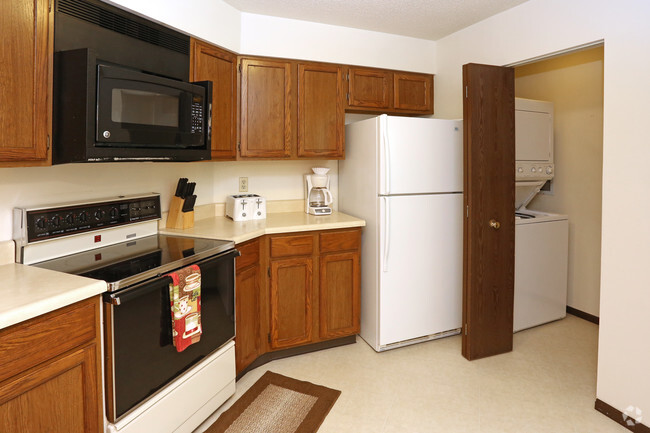 2BR, 2BA - 1,100 SF - Kitchen with laundry - Twin Oaks Apartments