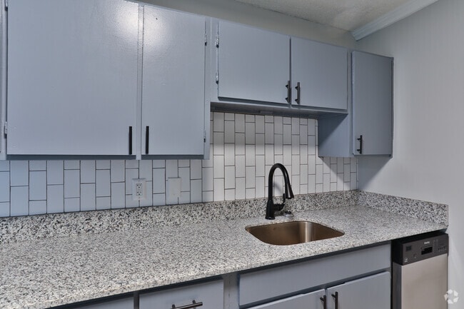 Kitchen with Glass Blacksplash - Magnolia Ridge Apartments