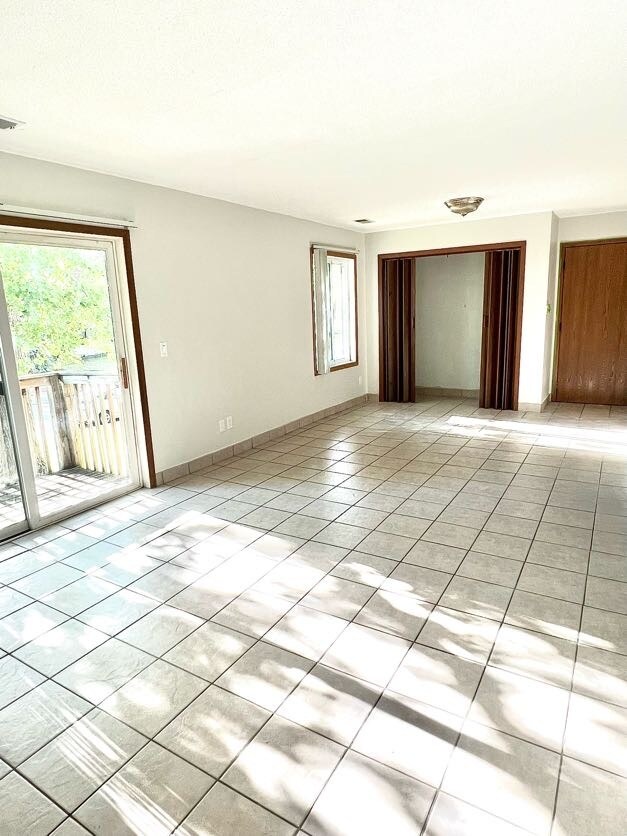 Sunny living room with closet - 6501 Channel Rd NE