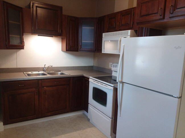 Cherry cabinets and Corian counters - 1 East Main St.