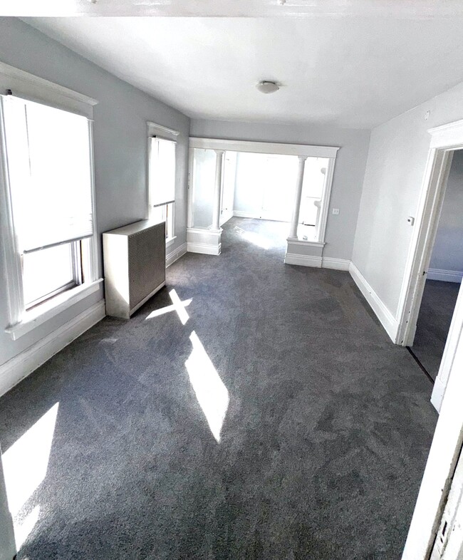 Middle room looking towards the front of the apartment. - 1118 W 8th St