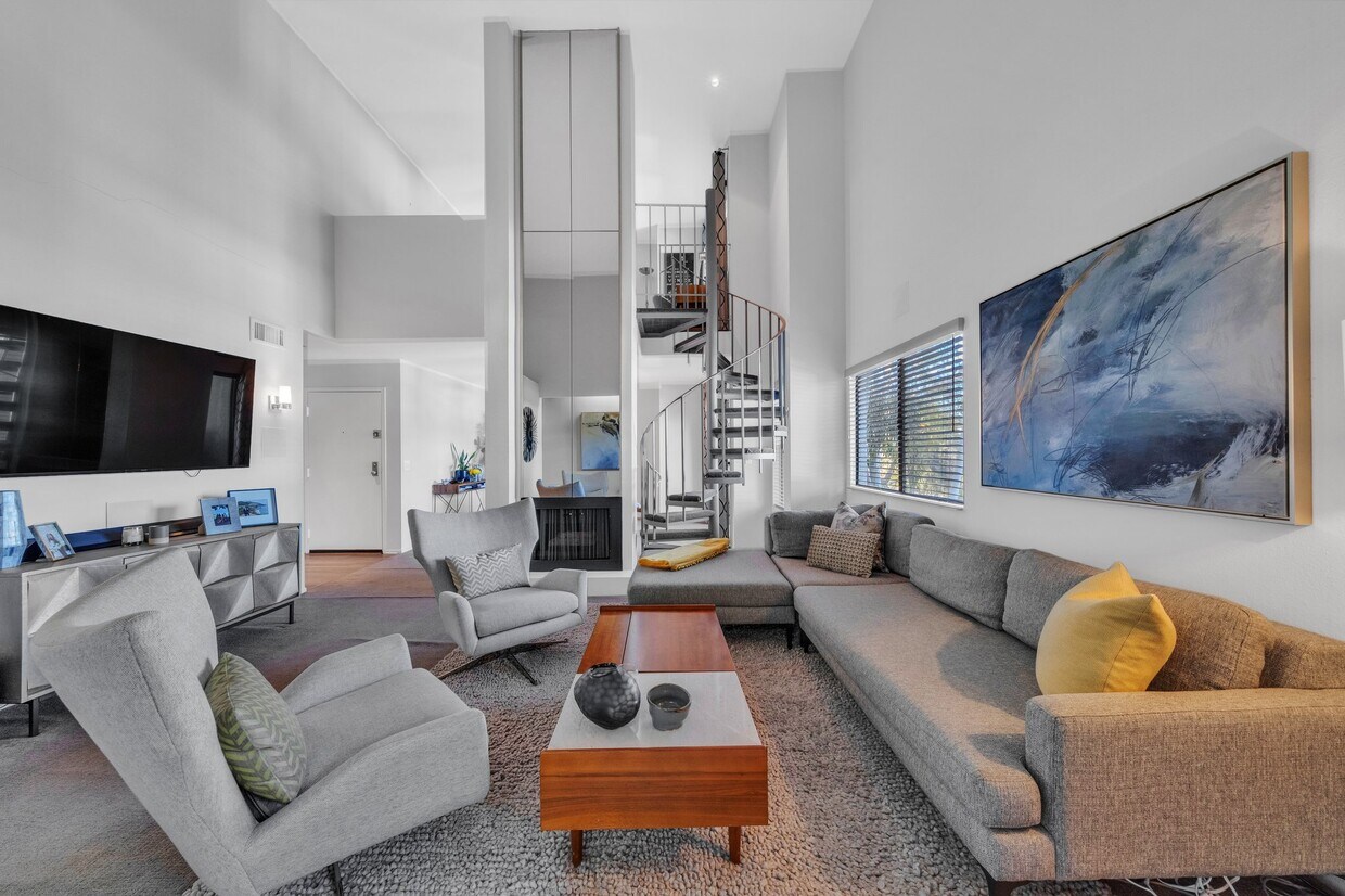 Living room with soaring ceilings - 909 N Sierra Bonita Ave