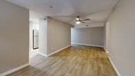 Located at 102 Brentway Cir in Knoxville, TN, this well-appointed one-bedroom, one-bathroom unit offers a thoughtfully designed single-floor layout. Wood-look luxury flooring flows consistently throughout every room, complemented by neutral warm-gray walls and crisp white trim, creating a clean and cohesive aesthetic.

The welcoming entrance leads into a hallway lined with closet storage before opening to the spacious living room, which features a ceiling fan with light fixture and connects seamlessly to the combined dining and kitchen area. The kitchen is well-equipped with white shaker-style cabinetry, granite-look countertops, stainless steel appliances including a range, microwave, and refrigerator, and convenient in-unit washer and dryer. A pantry and utility room provide additional storage and functionality.

The generously sized bedroom offers ample floor space, a ceiling fan, a window with natural light, and closet access. The full bathroom is finished with a gray vanity, granite countertop, framed mirror, and a tub-shower combination with tile surround. Three closets throughout the unit ensure plentiful storage. The overall layout is efficient and practical, making excellent use of the available space.