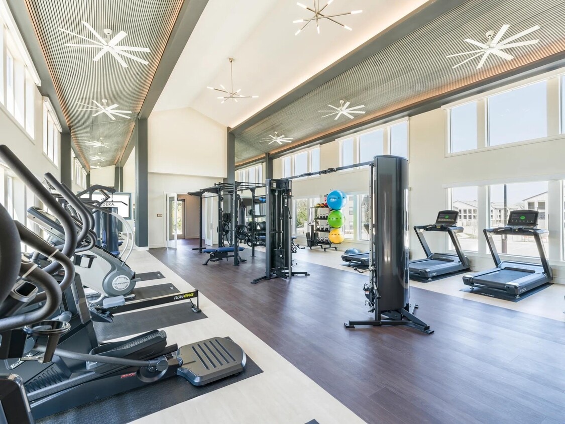 Premium Fitness Studio featuring cardio equipment, free-weights, state of the art equipment, including boxing zone and spin bikes. - Modera McKinney Ridge