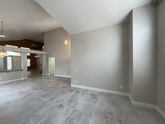 Building Photo - Spacious 4-bedroom, 3-car garage home feat...