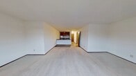 This 460 square foot apartment in Fitchburg, Wisconsin, offers a well-designed living space within a compact footprint. The unit features a single bedroom measuring an impressive 390 square feet, providing ample space for rest and relaxation. The open-concept layout seamlessly integrates the living area with the kitchen, maximizing the use of available space.

The kitchen, though compact, is fully equipped with essential appliances including a refrigerator and stove. Rich wood cabinetry adds warmth to the space, while a breakfast bar provides additional counter space and a casual dining area. The bathroom showcases vibrant yellow tiling, adding a cheerful accent to the space, and includes a bathtub-shower combination for versatility.

Large windows in the main living area flood the space with natural light, creating an airy atmosphere. The apartment features wall-to-wall carpeting in the living room and bedroom, contributing to a cozy ambiance. A window-mounted air conditioning unit ensures comfort during warmer months.

The efficient design includes a closet for storage, and the single-floor layout enhances accessibility. Located at 2925 Fish Hatchery Rd, this apartment offers a practical living solution for individuals seeking a low-maintenance lifestyle in a convenient location.