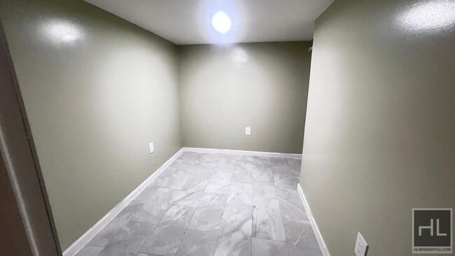 Building Photo - FRESHLY RENOVATED  2 BEDROOMS SEMI- BASEME...