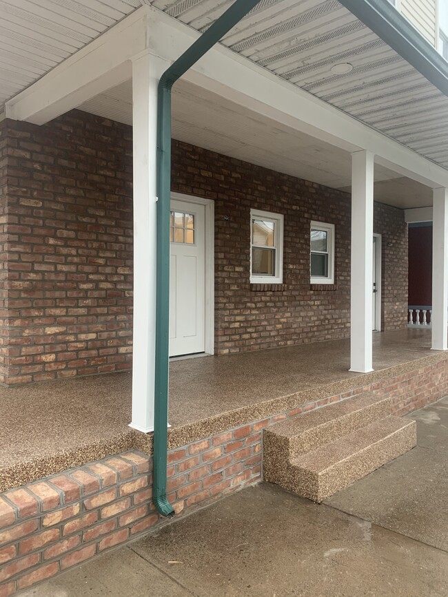 Shared front porch, with railings added - 250 Union St