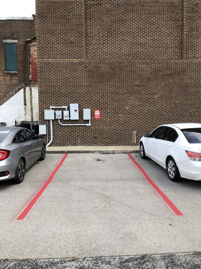 Reserved parking adjacent to building - 32 S Maysville St