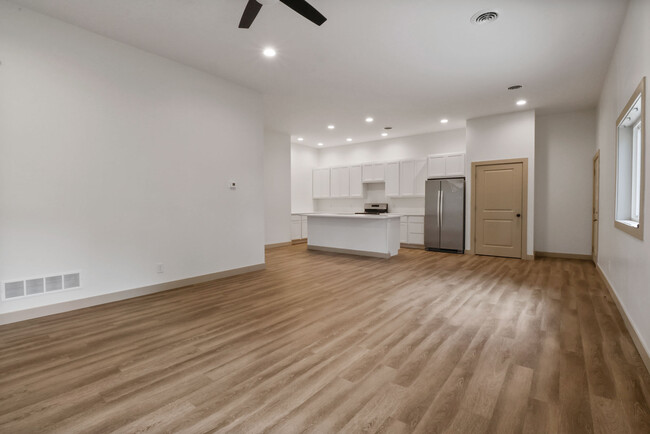 View from the living room towards the kitchen/dining and front door - 410 Pine Lake Ave