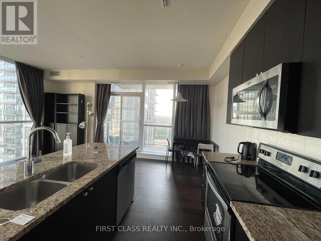 Photo du bâtiment - 339-1339 Rathburn Rd W