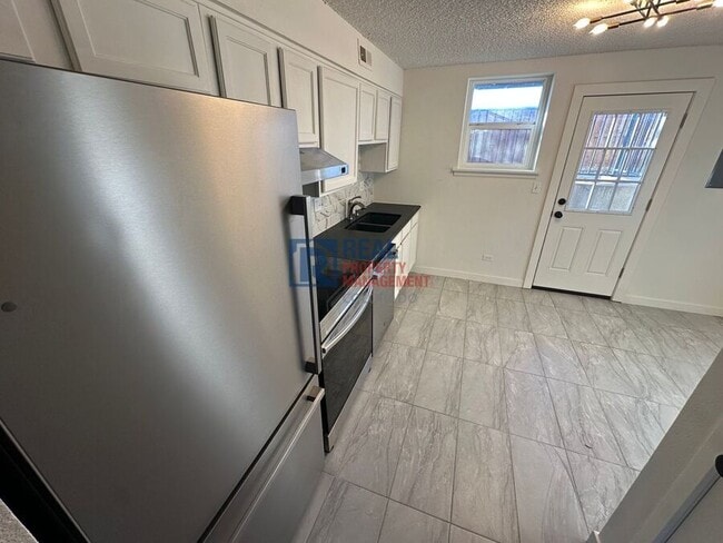 Building Photo - 9110 E Girard Ave