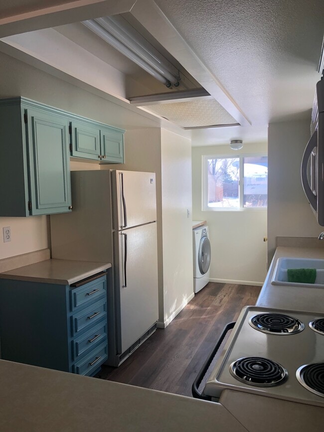 washer/dryer in the back of kitchen - 2520 E Cassidy Ln