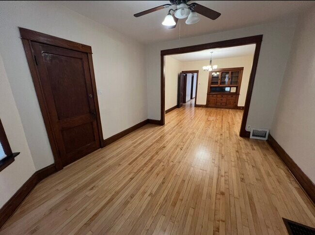 Living room with new ceiling fan - 3748 W Lyndale St