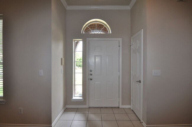 Building Photo - Welcome to this charming 3-2-2 brick home ...